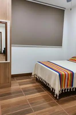 Cama o camas de una habitación en Condominio Alegre Amanecer