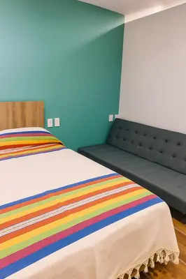 Cama o camas de una habitación en Condominio Alegre Amanecer