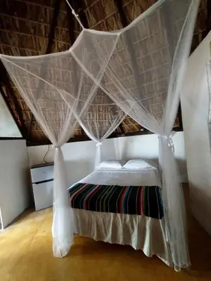 Cama o camas de una habitación en CAFE MAYA