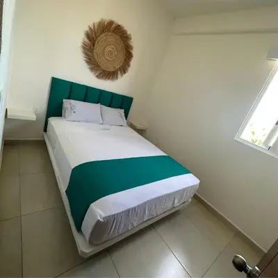 Cama o camas de una habitación en Condominio Aeromar