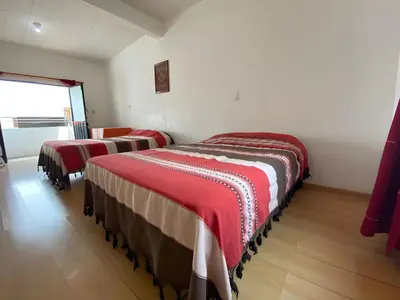Cama o camas de una habitación en Casa Magro depto para 6