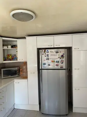 Una cocina o zona de cocina en Habitación con baño propio