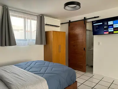 Cama o camas de una habitación en El Encanto Lofts