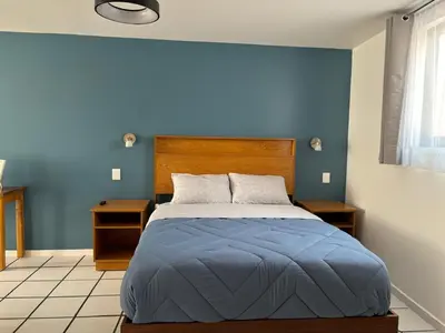 Cama o camas de una habitación en El Encanto Lofts