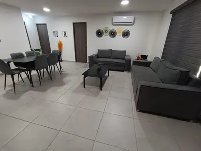 Zona de estar de Increíble departamento Club de Playa canchas de pádel para 8 huéspedes