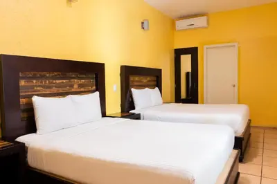 Cama o camas de una habitación en Happy Express Hotel