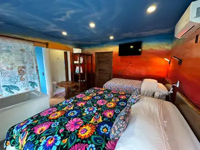 Cama o camas de una habitación en Beachfront Paradise Boutique Hotel - Alebrijes Jacuzzi Villa