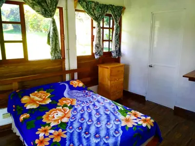 Cama o camas de una habitación en Quinta con alberca