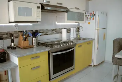 Una cocina o zona de cocina en Departamento céntrico, amplio y nuevo cerca del Aeropuerto y GNP-Foro sol