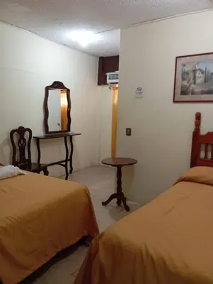 Cama o camas de una habitación en Hotel Juarez