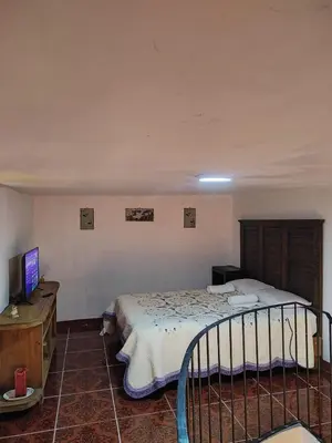 Cama o camas de una habitación en Hostal puebla