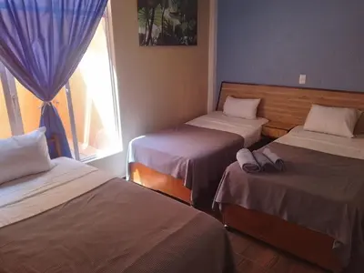 Cama o camas de una habitación en Hotel Los Diamantes