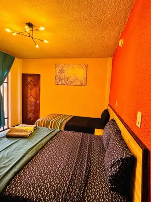 Cama o camas de una habitación en Hotel Diamantes