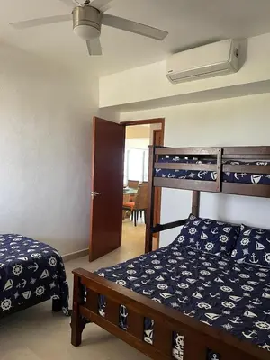Cama o camas de una habitación en Increíble depto. en playa privada.