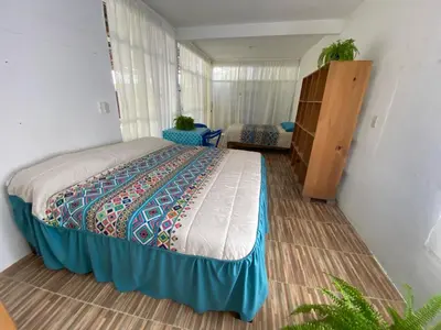Cama o camas de una habitación en Casa Mamá Lolis