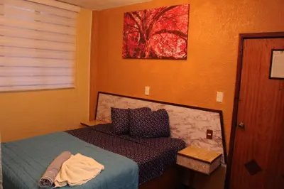 Cama o camas de una habitación en Hotel Los Diamantes Orizaba