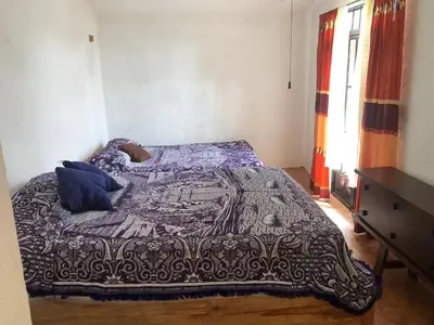 Cama o camas de una habitación en Casa antigua llena de vida, alberca en Cuernavaca