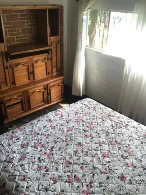 Cama o camas de una habitación en Casa antigua llena de vida, alberca en Cuernavaca