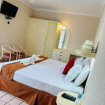 Cama o camas de una habitación en Hotel Hacienda del Rio Oaxtepec