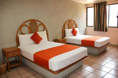 Cama o camas de una habitación en Hotel Huautla de Oaxaca