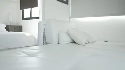 Cama o camas de una habitación en Suites del Valle