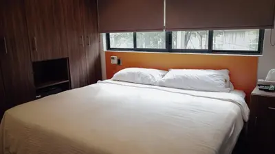 Cama o camas de una habitación en Suites del Valle