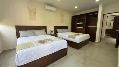 Cama o camas de una habitación en Nabani Condominios T1
