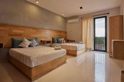Cama o camas de una habitación en Casa Boutique Peñasco Oaxaca