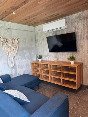 Una televisión o centro de entretenimiento en Nabani Condominios T3