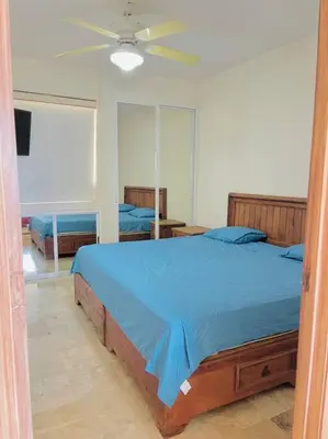 Cama o camas de una habitación en Espectacular departamento a pasos de costera