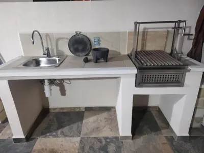 Una cocina o zona de cocina en Cerca de Salones de Fiesta, con Alberca, AC e Internet