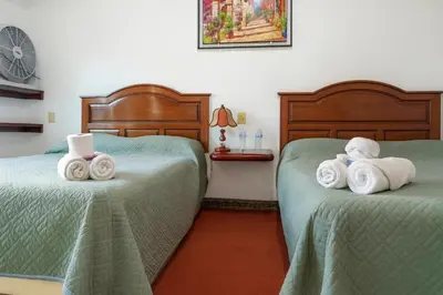 Cama o camas de una habitación en Hotel Casa Maximiliano