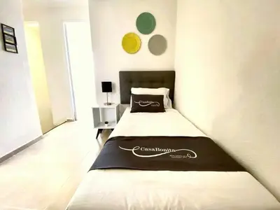 Cama o camas de una habitación en LA CASABONITA vistalberca AirA