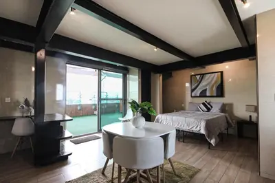 Cama o camas de una habitación en Luxury Rooftop SuiteB