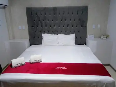 Cama o camas de una habitación en AUTO HOTEl MONTE CARLO