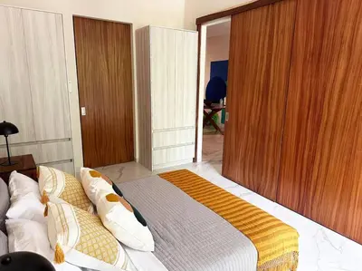 Cama o camas de una habitación en Biulu Apartment at Tangolunda Bay