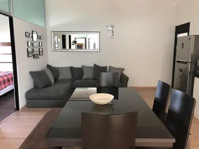 Zona de estar de Penthouse in front of Estrella de Puebla 16 guest