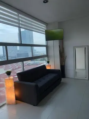 Zona de estar de Penthouse in front of Estrella de Puebla 16 guest