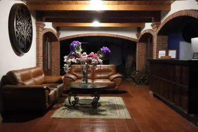 Zona de estar de Hotel Cuamanco
