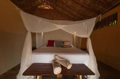 Cama o camas de una habitación en Cabanas Adobe Frente Al Mar