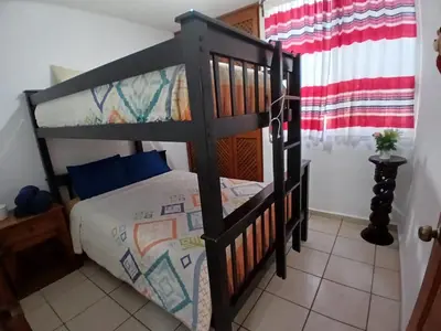 Cama o camas de una habitación en Departamento bonito en Huatulco