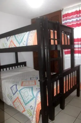Cama o camas de una habitación en Departamento bonito en Huatulco