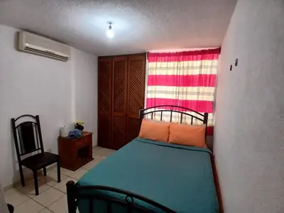 Cama o camas de una habitación en Departamento bonito en Huatulco