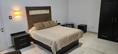 Cama o camas de una habitación en Nonó Hotel