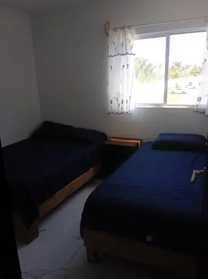 Cama o camas de una habitación en Hermoso departamento en Acapulco para vacacionar
