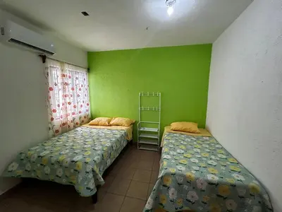 Cama o camas de una habitación en Casa Flor de Mayo