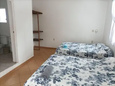 Cama o camas de una habitación en Casa Fefe Huatulco