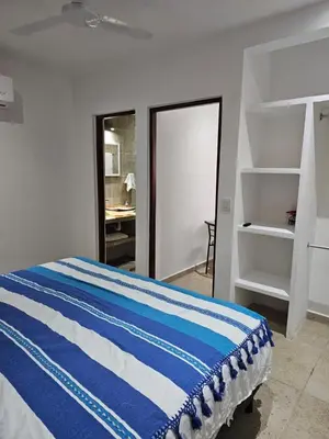 Cama o camas de una habitación en Nayuu' Estudio