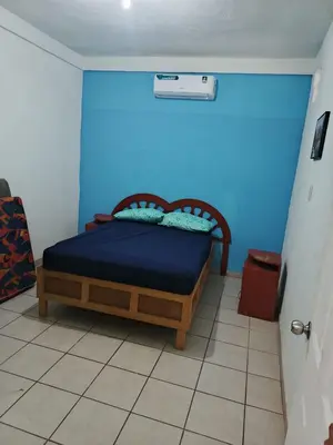 Cama o camas de una habitación en Casa de descanso, poblado casitas, frente al mar