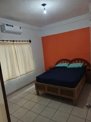 Cama o camas de una habitación en Casa de descanso, poblado casitas, frente al mar